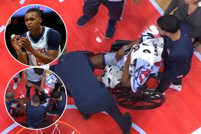 Wizards' Carlton Carrington exits in wheelchair after hitting head